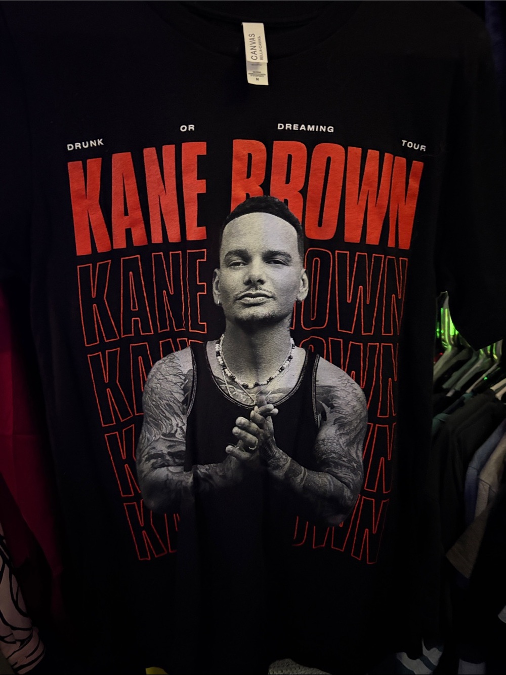 Bella Canvas Black Tee with Red Kane Brown Graphic
